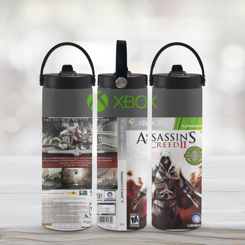 Three sports water bottles with 'Assassin's Creed II' and Xbox branding on a light wooden surface.