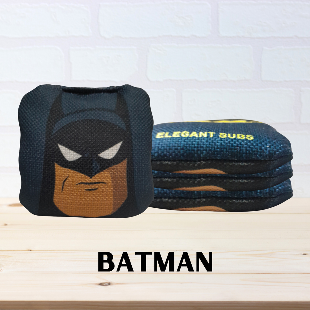 Mini cornhole bags with batman theme on a light-colored background.