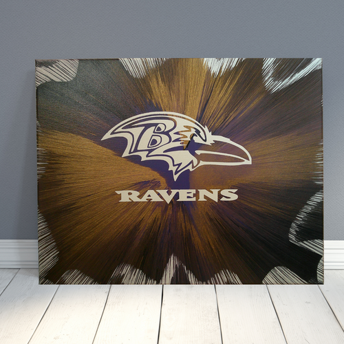 Baltimore Ravens Spin Art canvas against a gray wall.