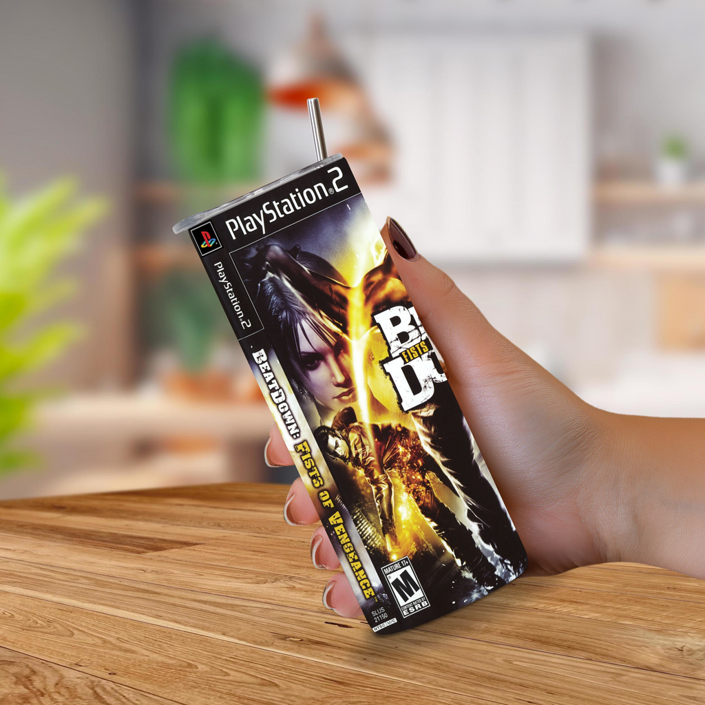 A hand holding a PlayStation 2 themed 20oz stainless steel tumbler with a straw, featuring Beat Down Fist of Vengeance artwork, against a blurred indoor background.