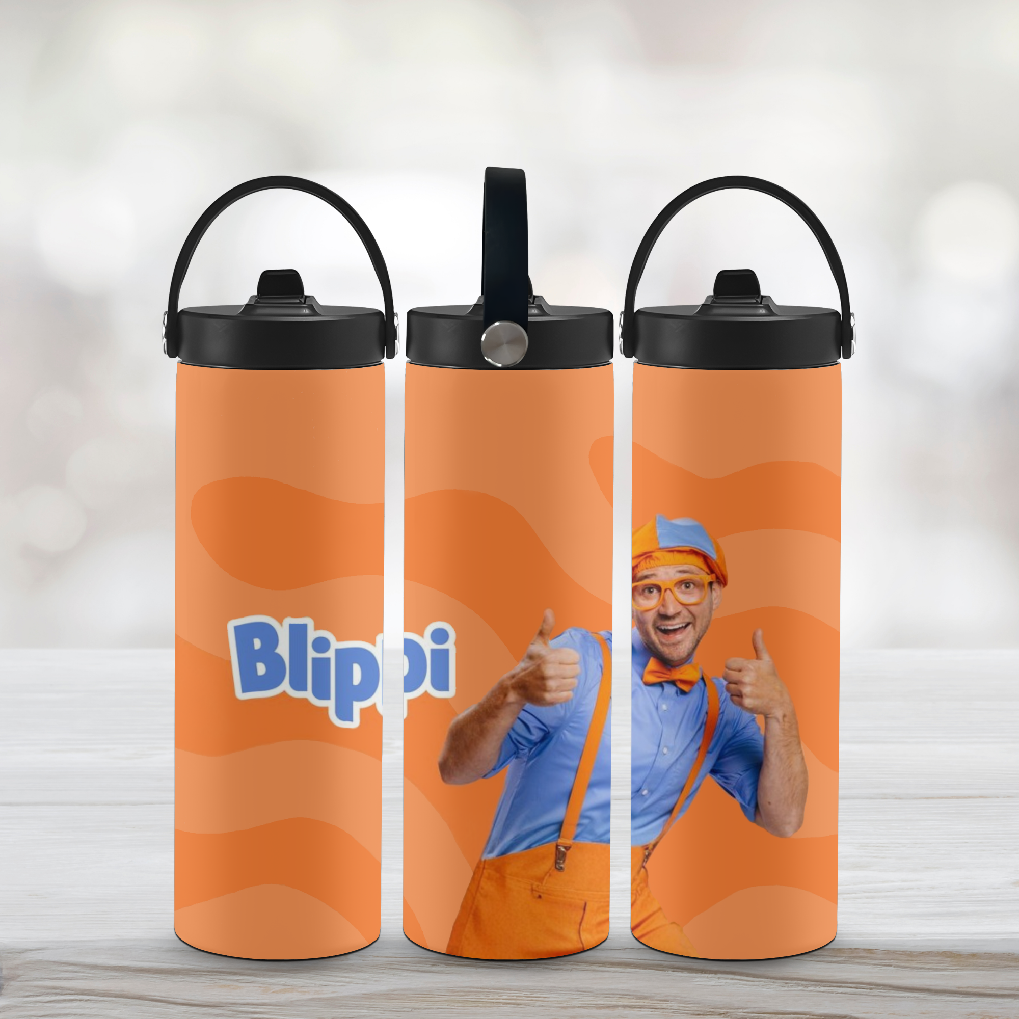 Three custom orange Blippi sports water bottles with a character on a light background.