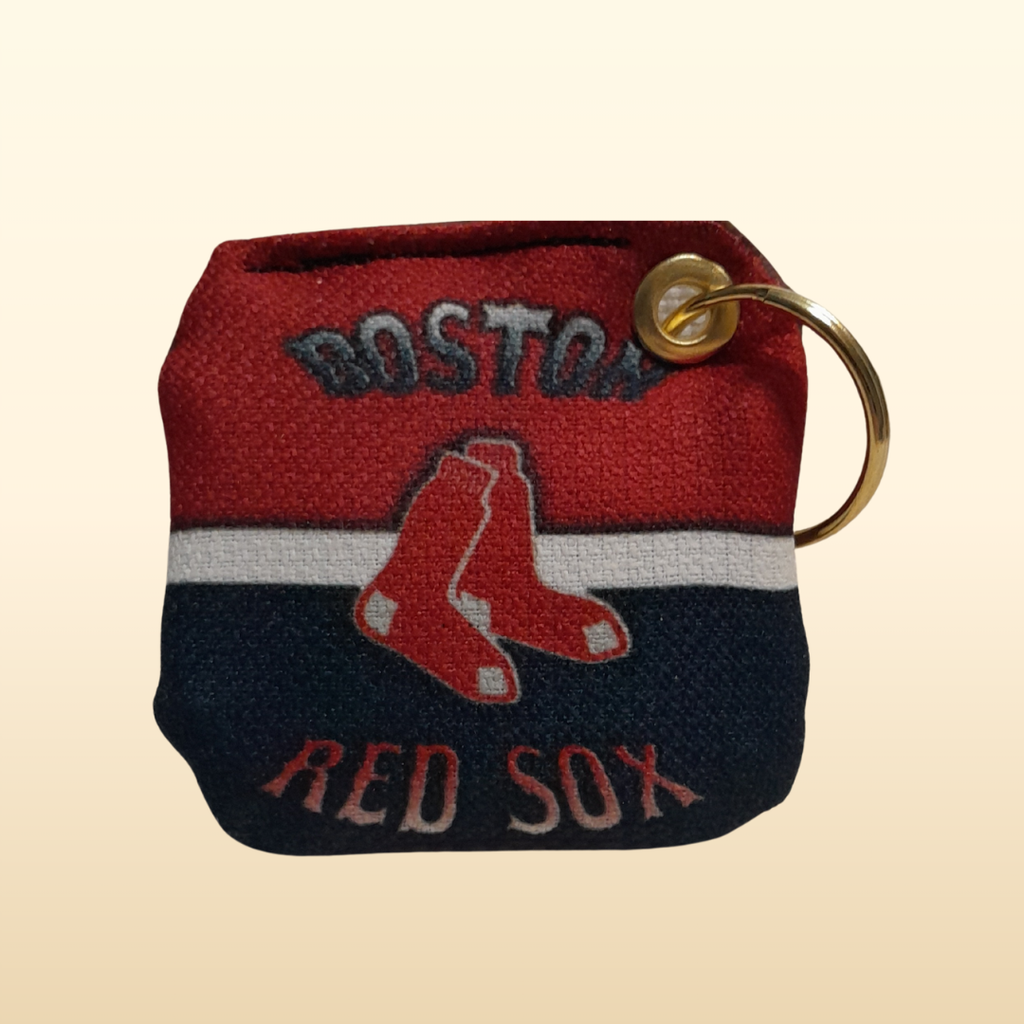Boston Red Sox keychain pouch on a beige background