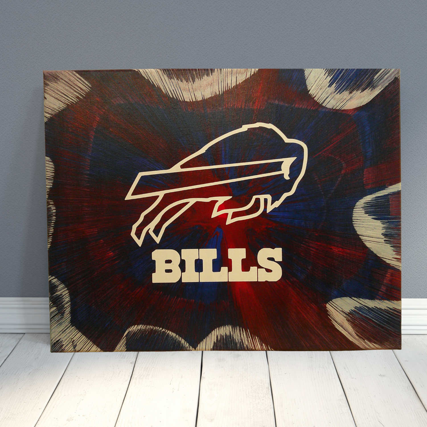 Spin art piece with a Buffalo Bills logo on a textured background wall