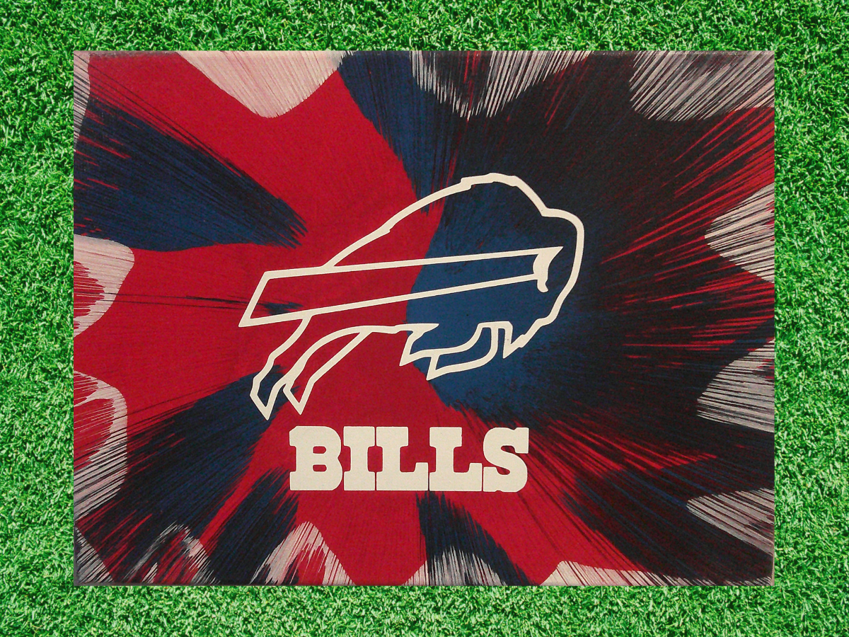 Buffalo Bills Spin Art canvas wall art on a green grass background. 