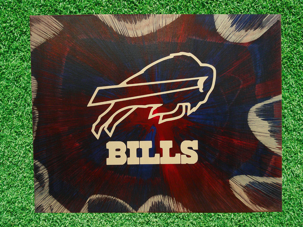 Spin Art Buffalo Bills logo on a green grass background