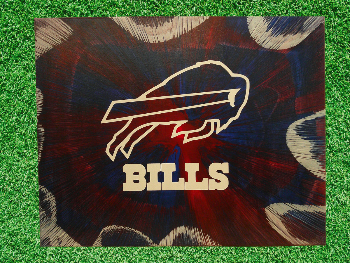 Spin Art Buffalo Bills logo on a green grass background