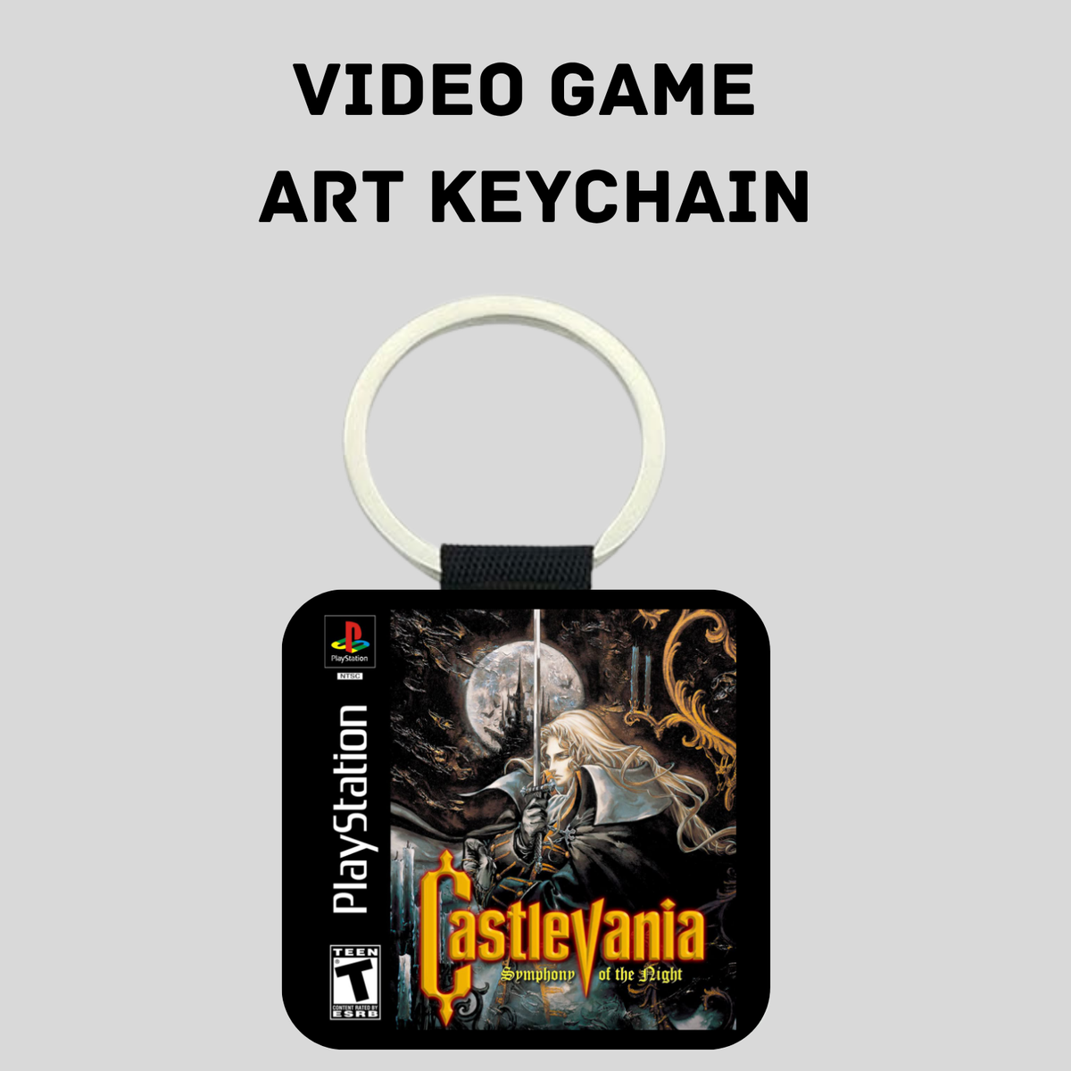 A PlayStation Castlevania art keychain featuring artwork from 'Castlevania: Symphony of the night' on a black square tag with a white key ring, shown against a light gray background with the text 'VIDEO GAME ART KEYCHAIN' above it.