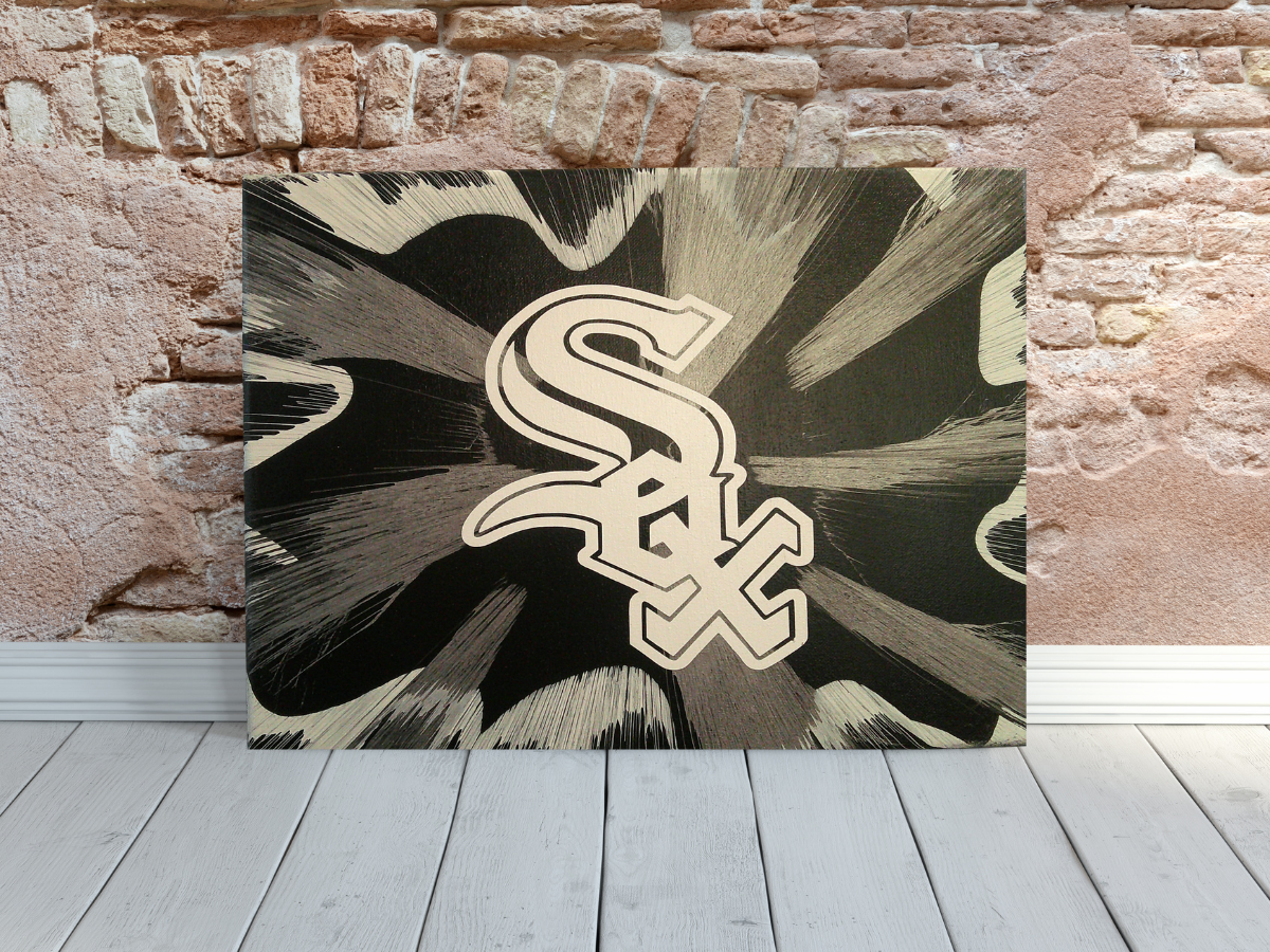 Chicago White Sox Spin Art canvas wall art leaning on a brick wall background.
