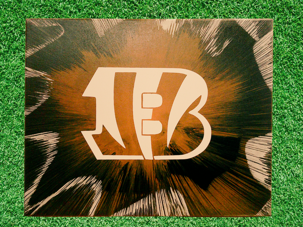 Bengals spin art canvas on a green grass background