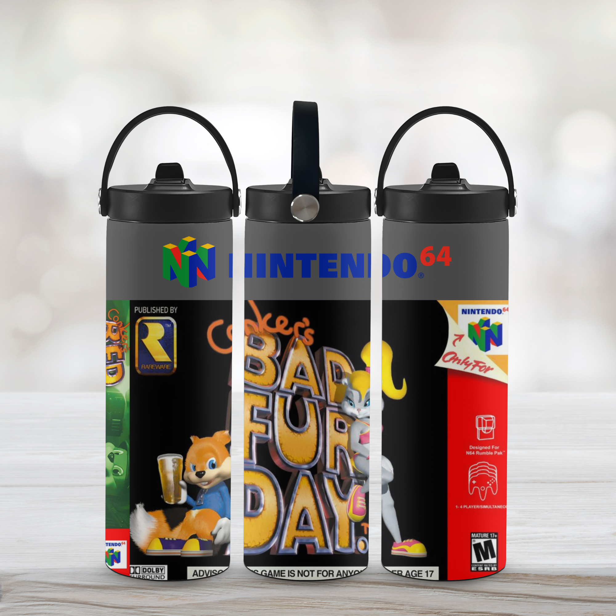 Three sports water bottles with conker bad fur day themed designs on a wooden surface.