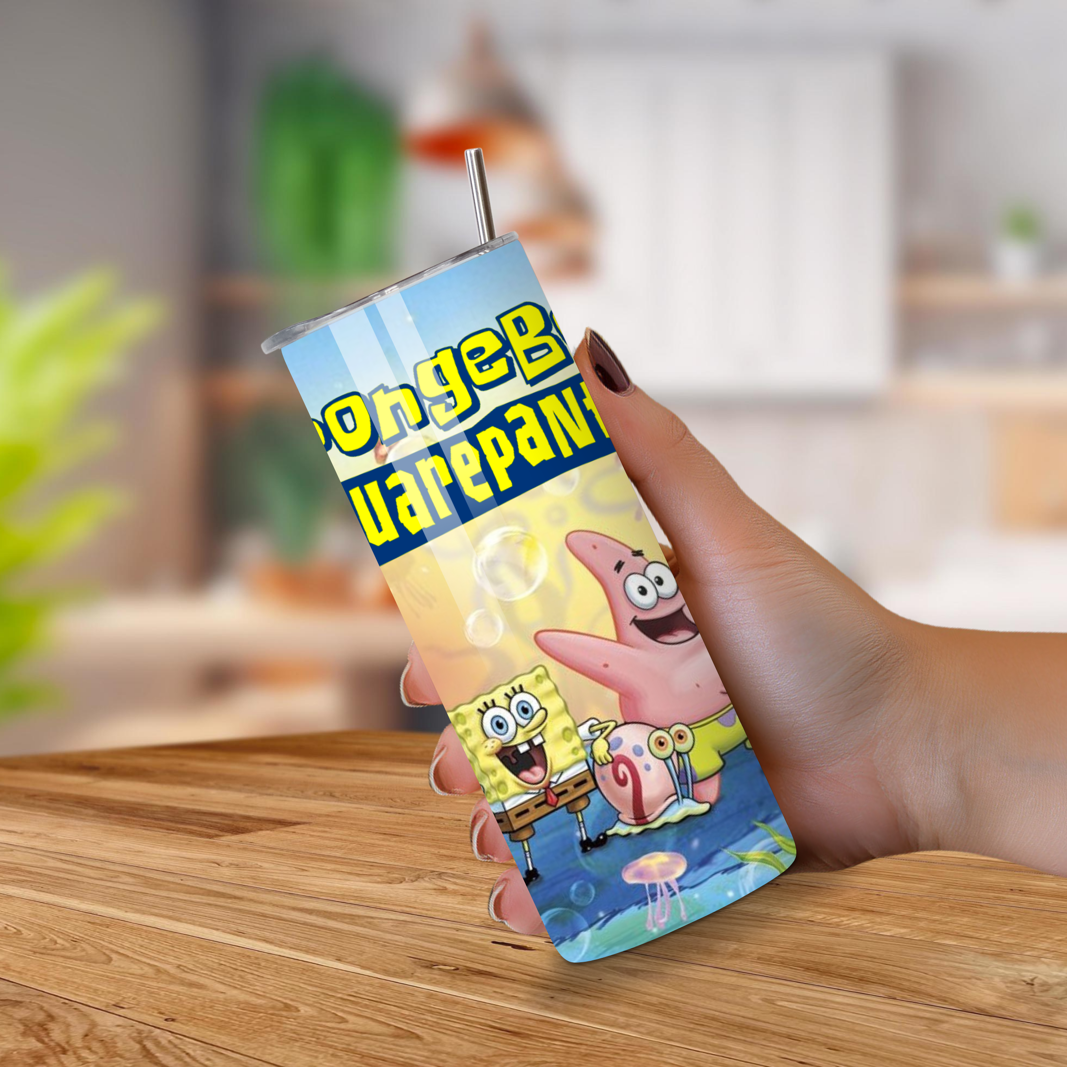 SpongeBob Tumbler with cartoon characters on a wooden surface