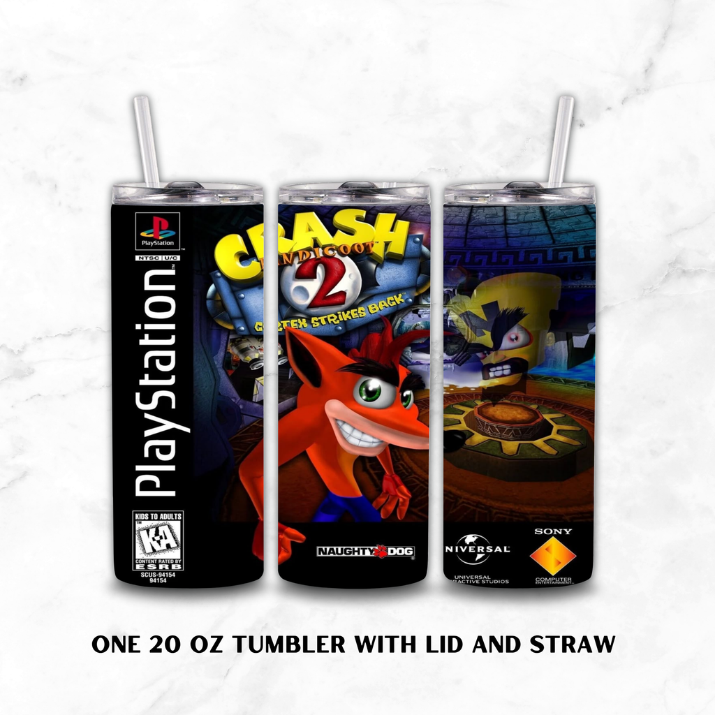 Three 20 oz tumbler cups with lids and clear straws, shown side by side on a white marble background. The tumblers feature PlayStation-themed artwork, including the PlayStation logo, Crash Bandicoot 2.