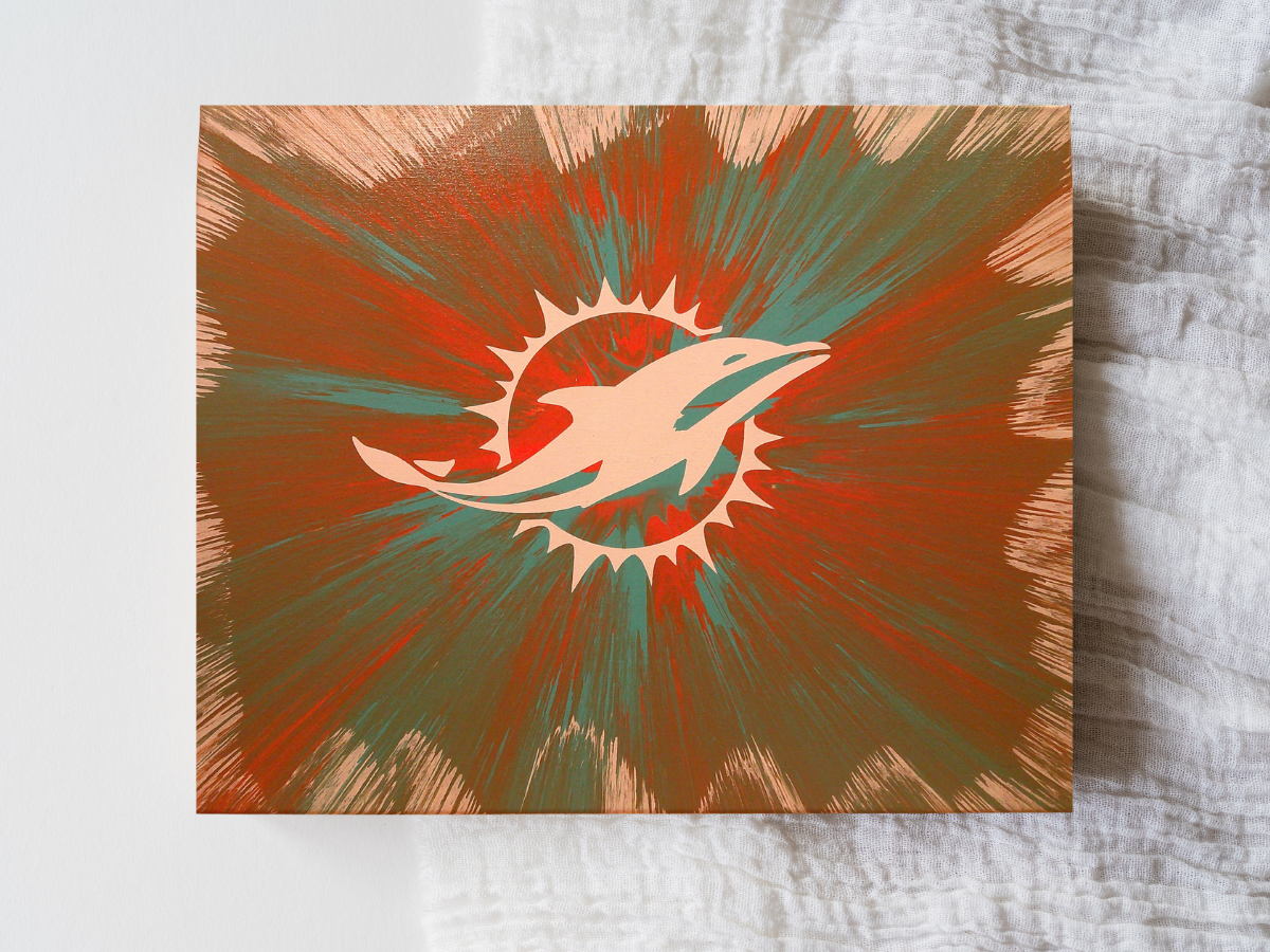 Custom Miami Dolphins wall art created using spin‑art technique with bold team‑color patterns