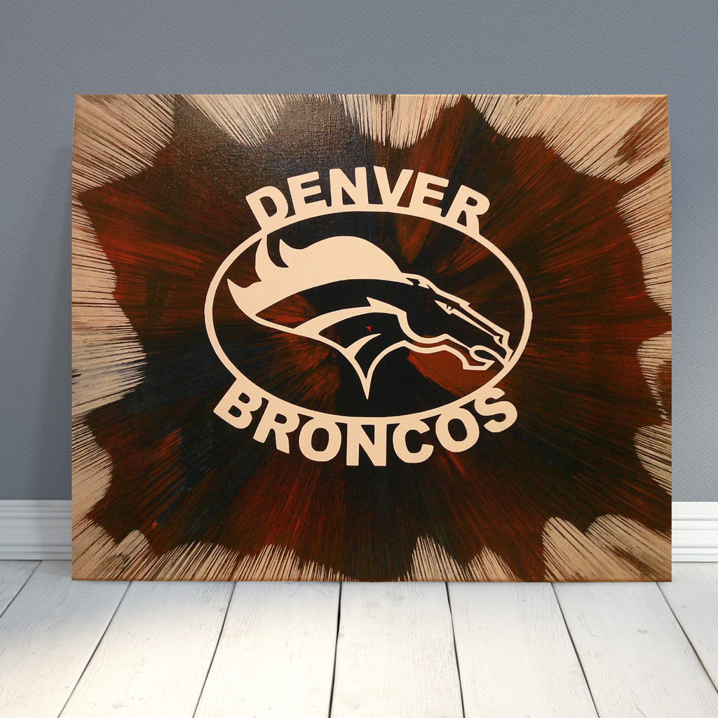 Custom Denver Broncos wall art created using spin‑art technique with bold team‑color patterns