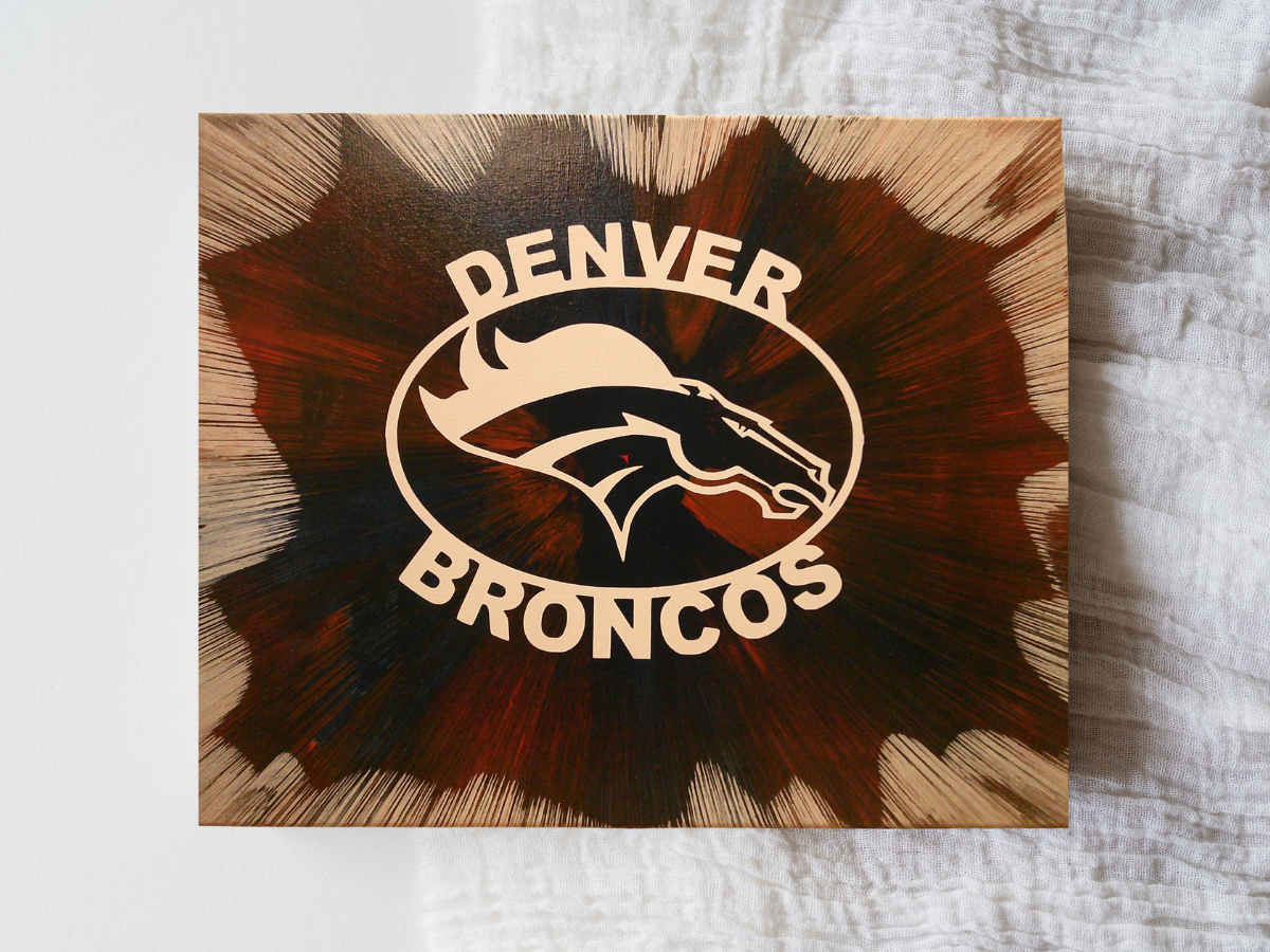 Handmade abstract spin art inspired by Denver Broncos team colors, perfect for sports fan décor