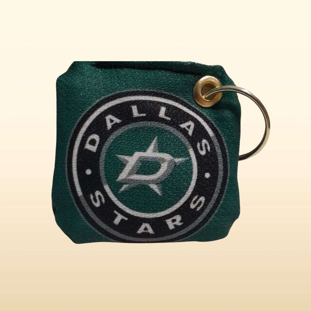 Dallas Stars keychain on a beige background