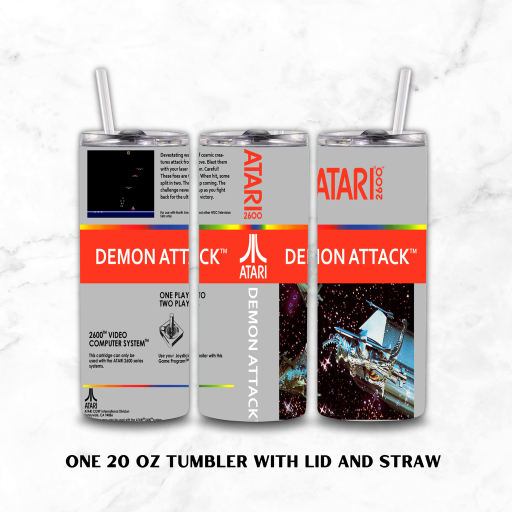 Three views of a 20 oz stainless steel tumbler with lid and straw, featuring a retro Atari 2600 'Demon Attack' video game themed wrap design on a white marble background.