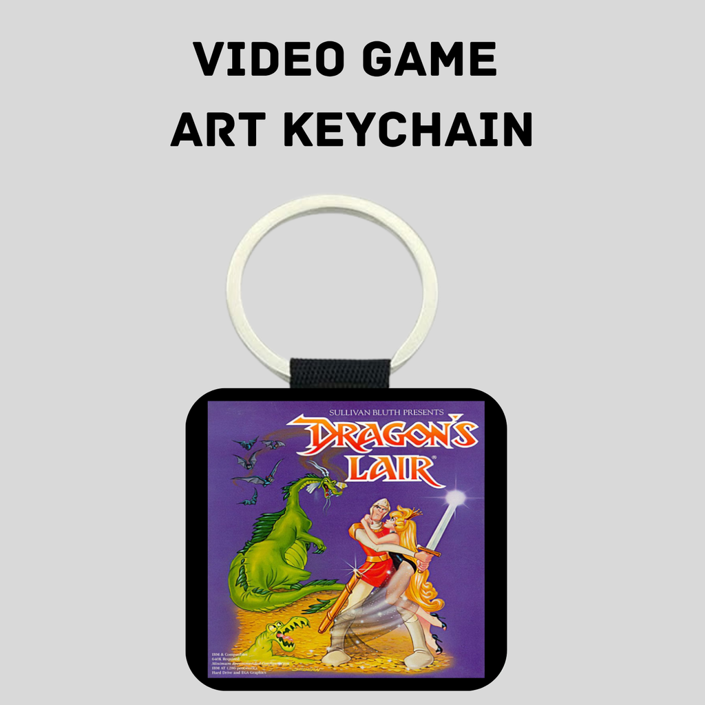 A square video game art keychain featuring artwork from 'Dragon's Lair' on a purple background, with a white key ring and black strap, shown against a light gray background with the text 'VIDEO GAME ART KEYCHAIN' above it.