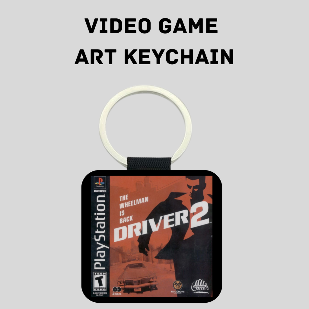 A PlayStation-themed art keychain featuring artwork from the video game Driver 2, with a silver key ring and black strap, shown on a light gray background with the text 'VIDEO GAME ART KEYCHAIN' above it.