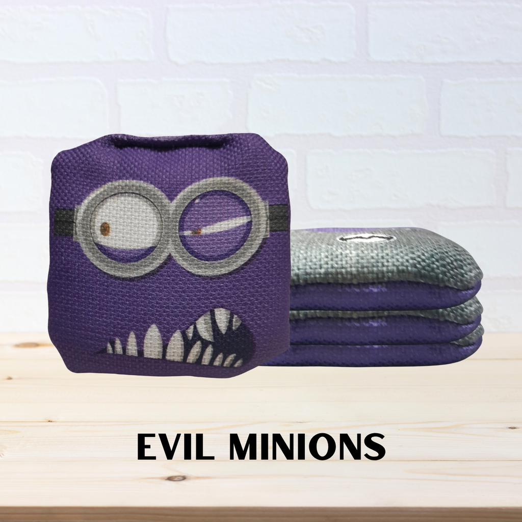 Purple and gray mini cornhole bags with evil minion design on a wooden surface