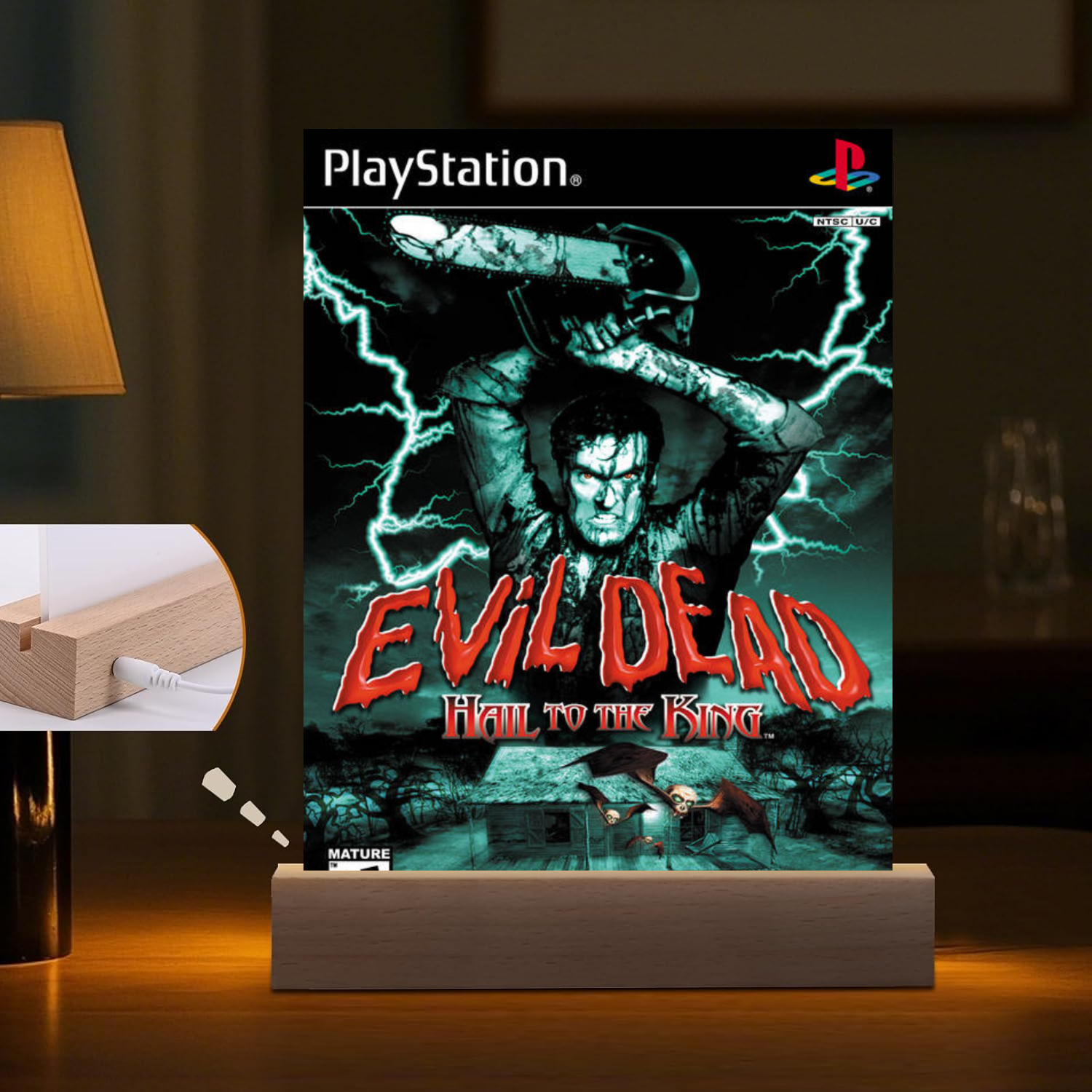 PlayStation 'Evil Dead: Hail to the King' game LED Night Light on a stand with a lamp in the background