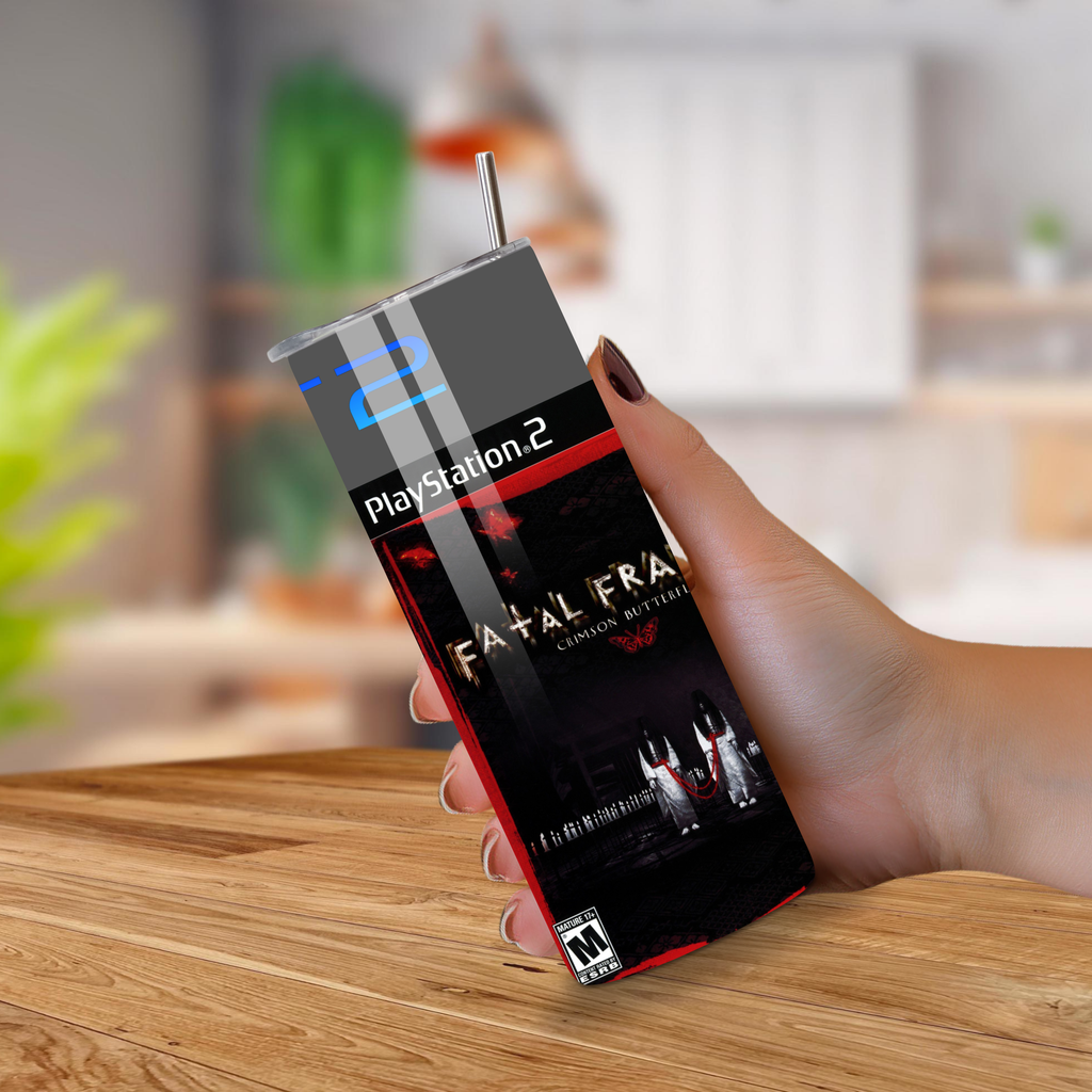 20oz tumbler with 'Fatal Frame' cover held by a hand on a wooden surface.