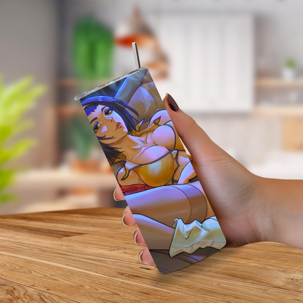 Tumbler with a colorful anime Faye Valentine held by a hand on a wooden surface.