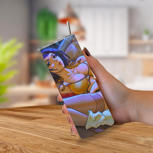 Tumbler with a colorful anime Faye Valentine held by a hand on a wooden surface.