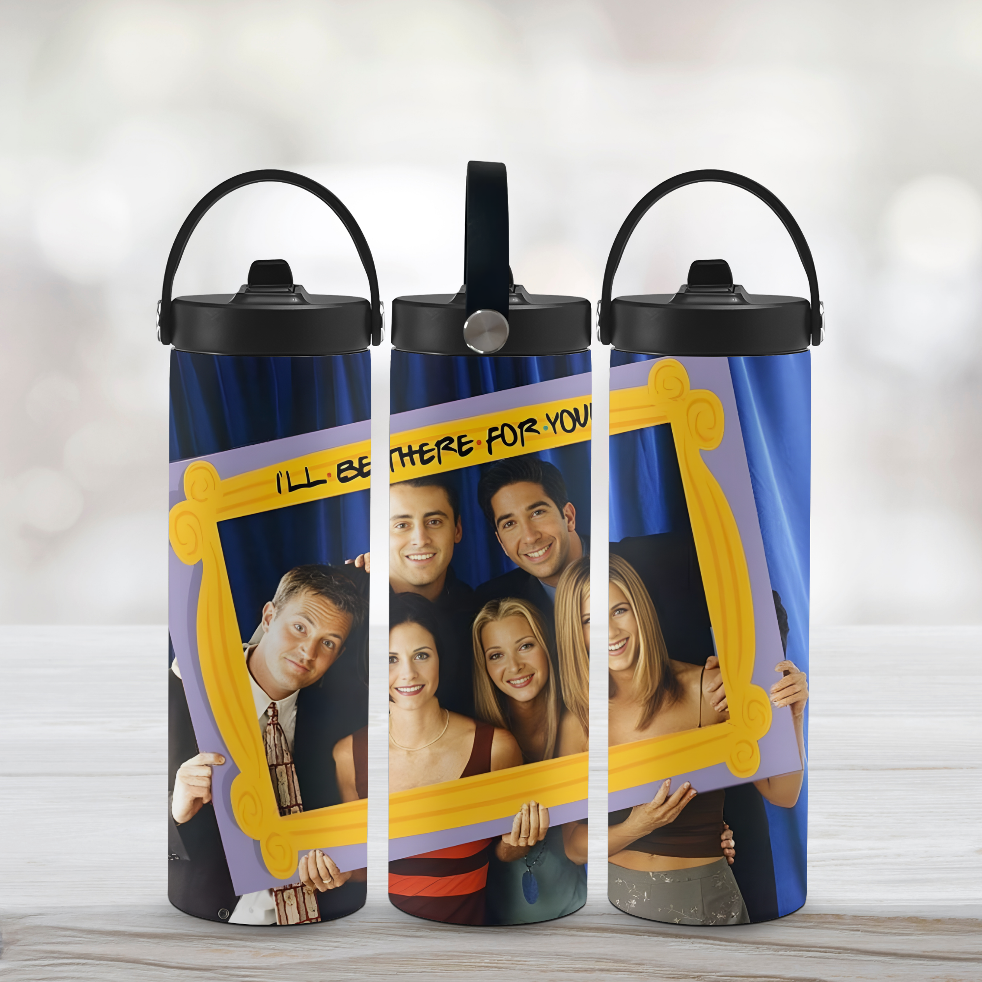 Three water bottles with 'Friends'-themed design on a light wooden surface.