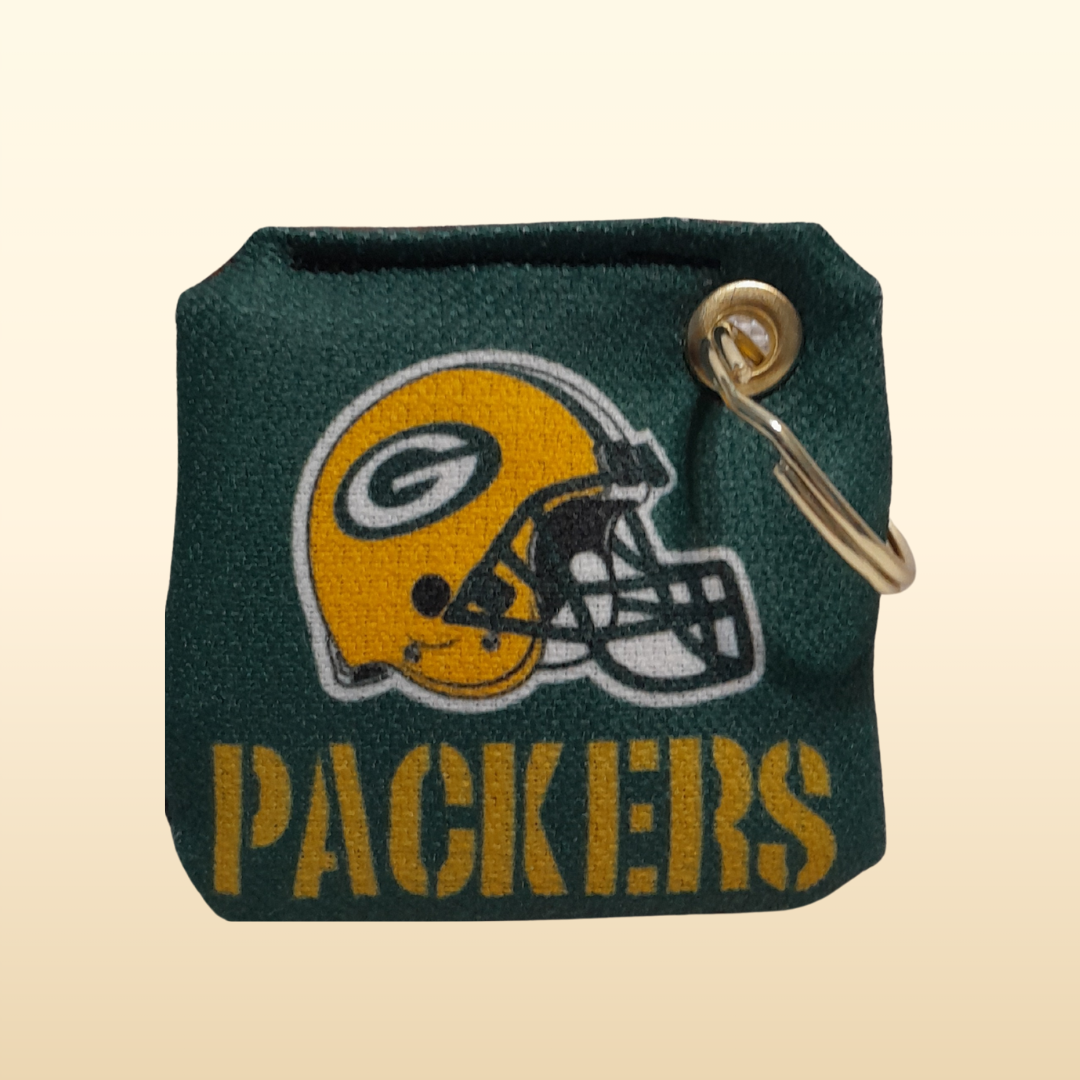 Green Bay Packers keychain pouch with helmet logo on a beige background