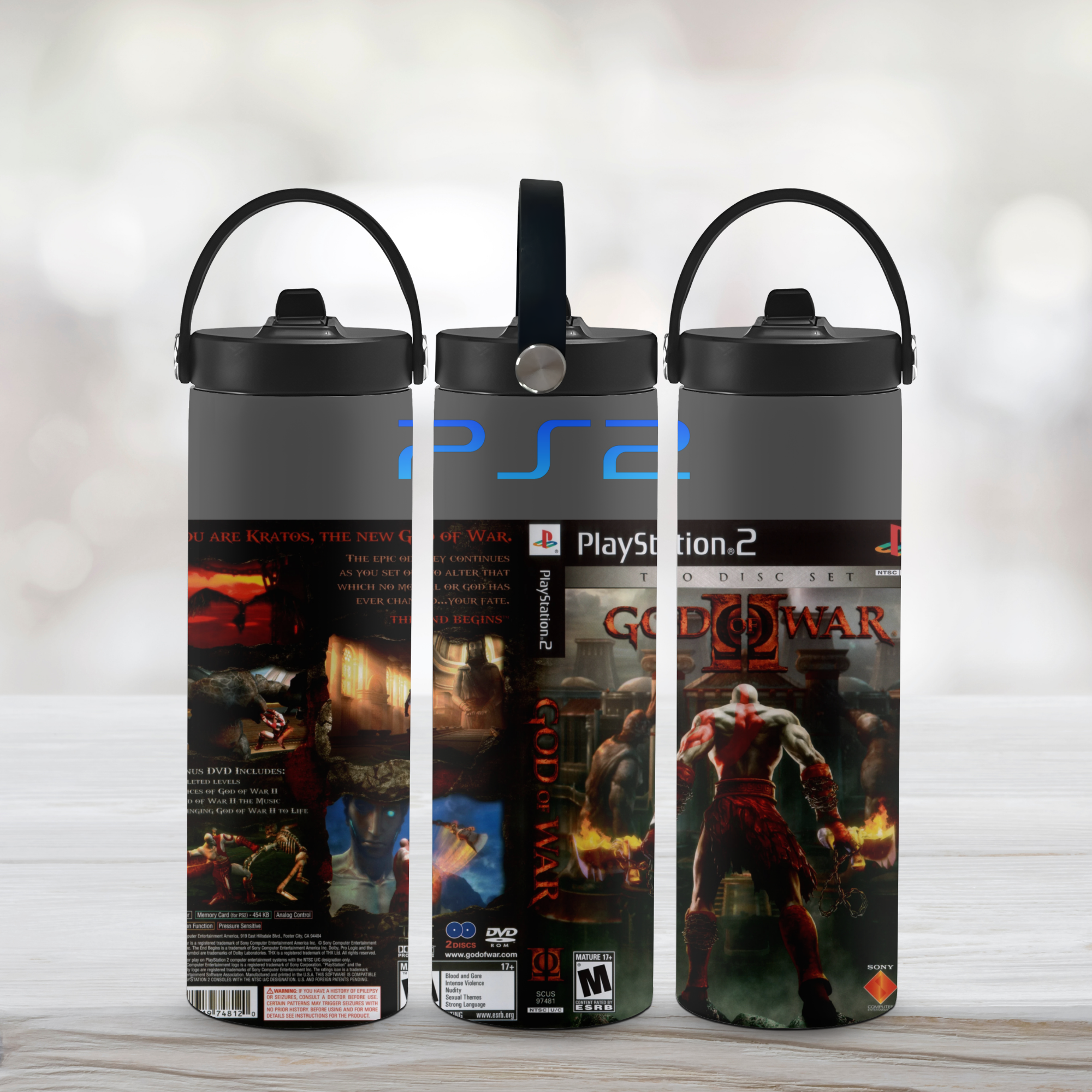 Three sports water bottles with 'God of War' and 'PlayStation 2' designs on a light background