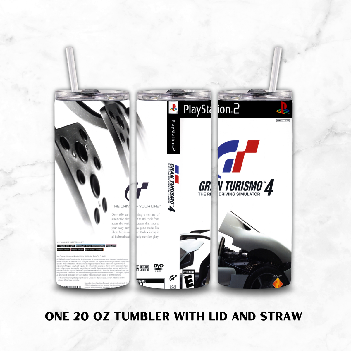 Three views of a 20 oz tumbler with lid and straw, featuring a Gran Turismo 4 PlayStation 2 themed wrap design, shown on a white marble background with text reading 'ONE 20 OZ TUMBLER WITH LID AND STRAW'.