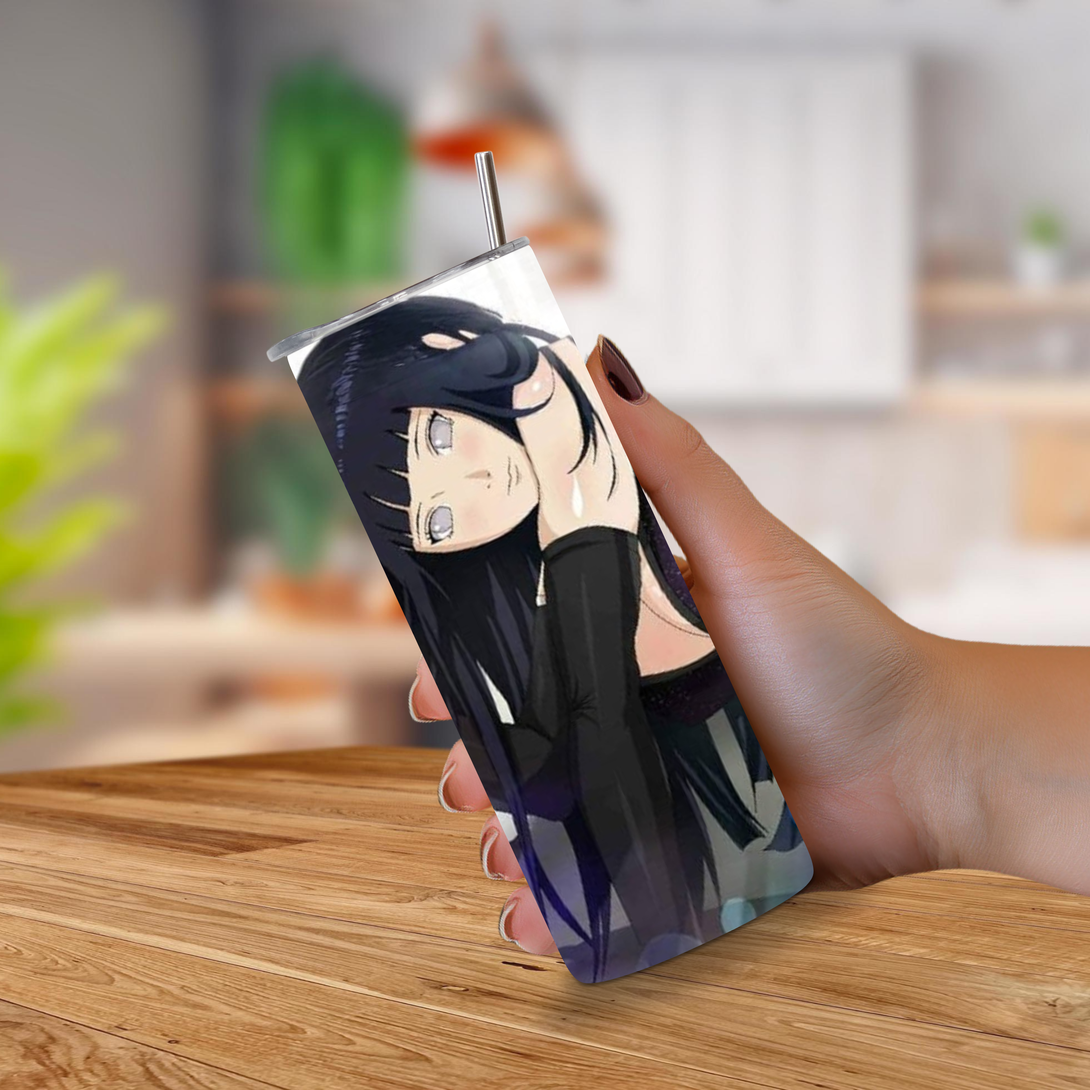 20oz Tumbler with anime Hinata Hyuga held by a hand on a wooden surface