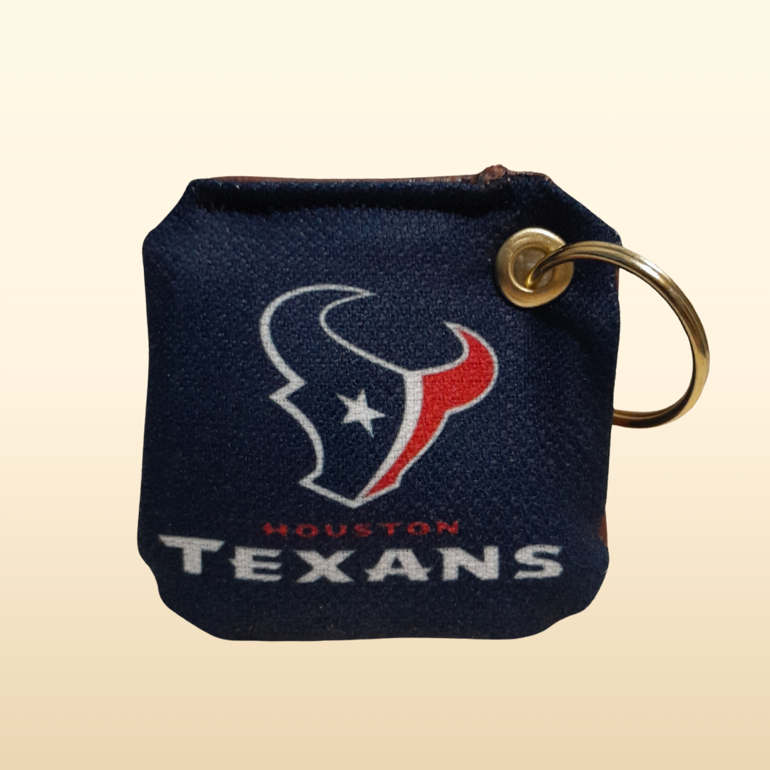 Houston Texans keychain on a beige background