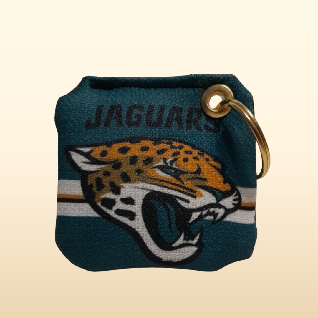Keychain with Jacksonville Jaguars logo on a beige background