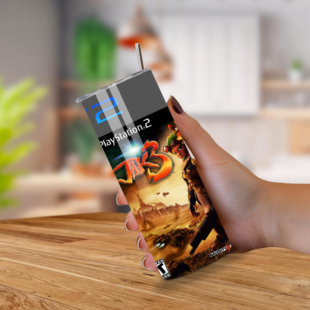Jak 3 20oz tumbler held by a hand on a wooden surface with a blurred indoor background
