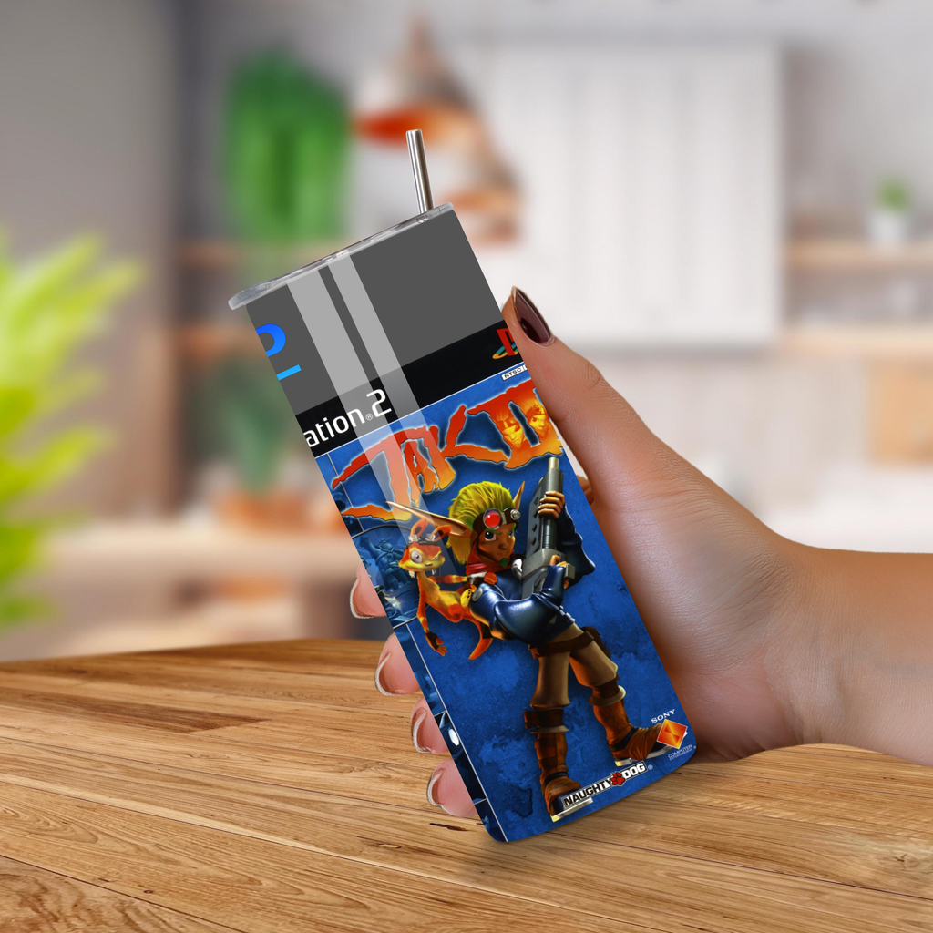 20oz tumbler with Jak II design held by a hand on a wooden surface.