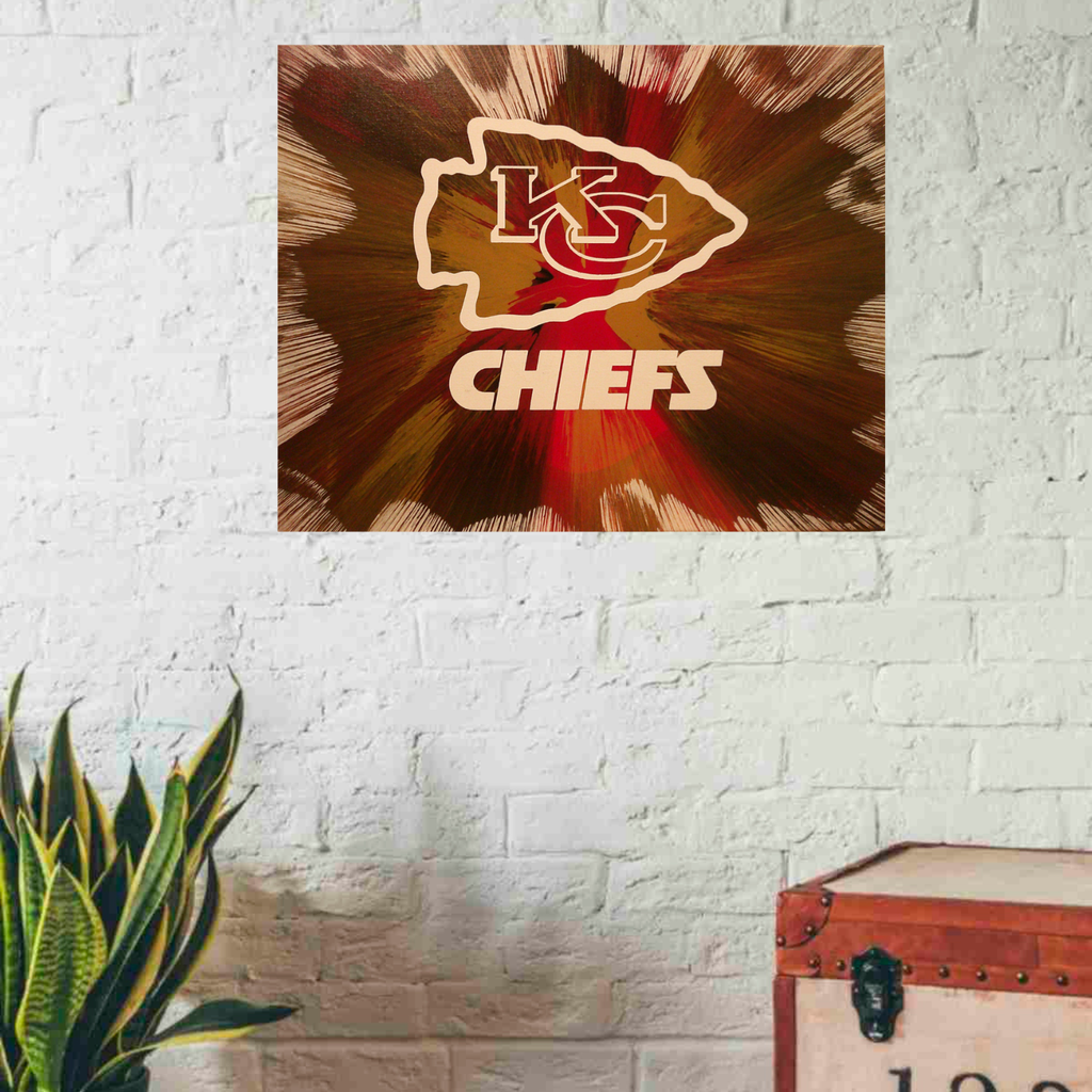 Kansas City Chiefs Spin Art on a white brick wall with a plant and suitcase.