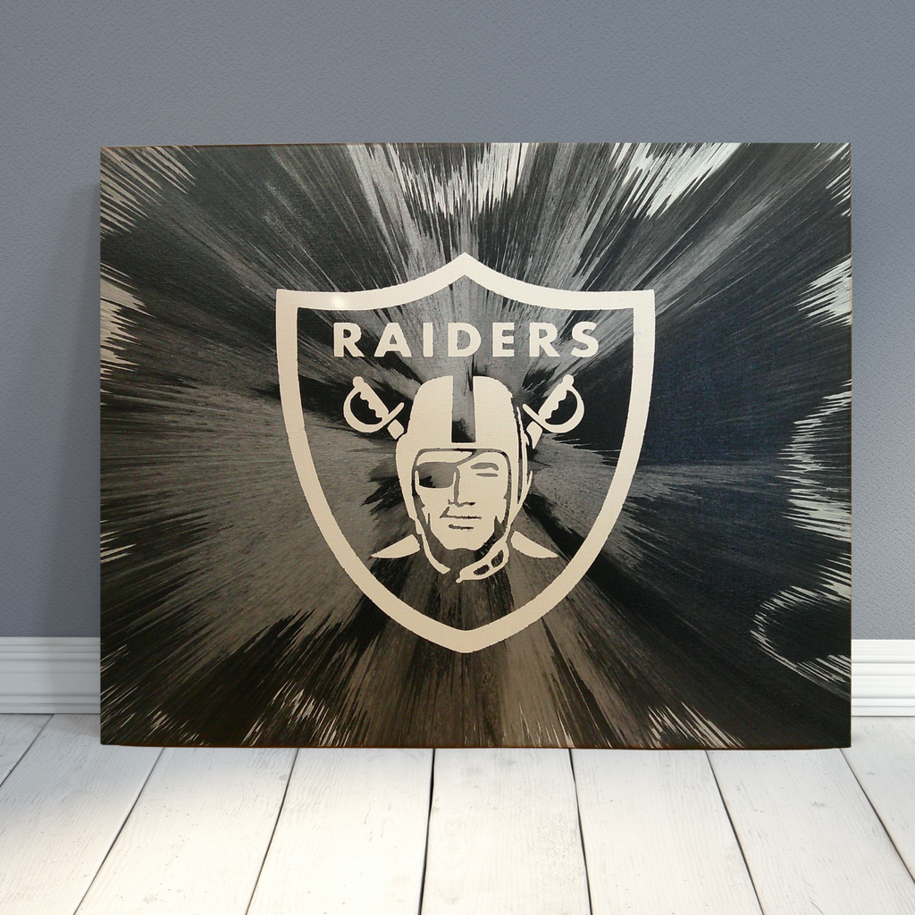 Spin Art canvas of Las Vegas Raiders logo with bold team colors on a textured wall background