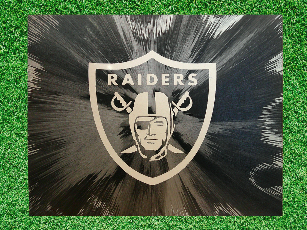 Las Vegas Raiders Football Spin Art on a green grass field