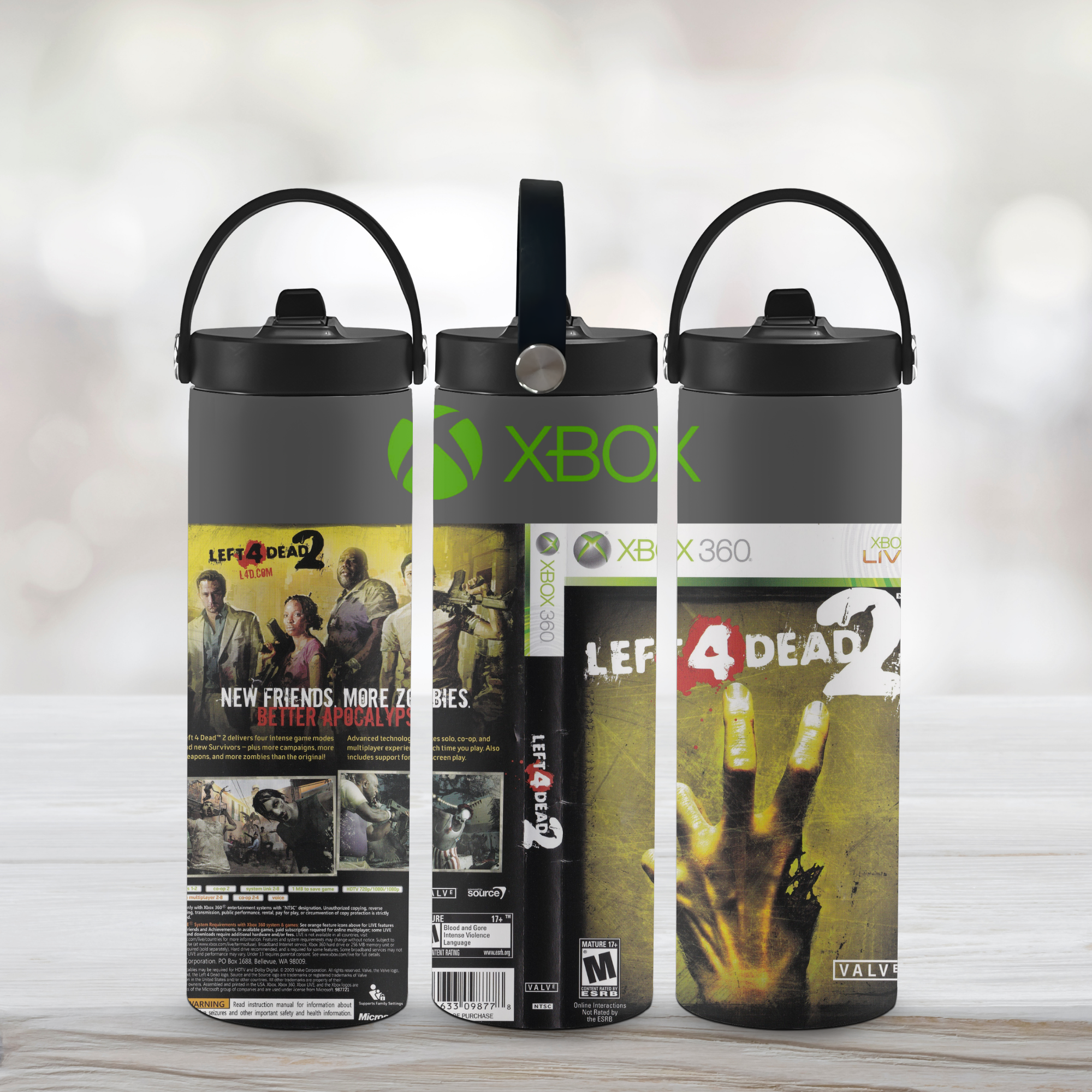 Three sports water bottle designs featuring Xbox and Left 4 Dead 2 branding on a light wooden surface.