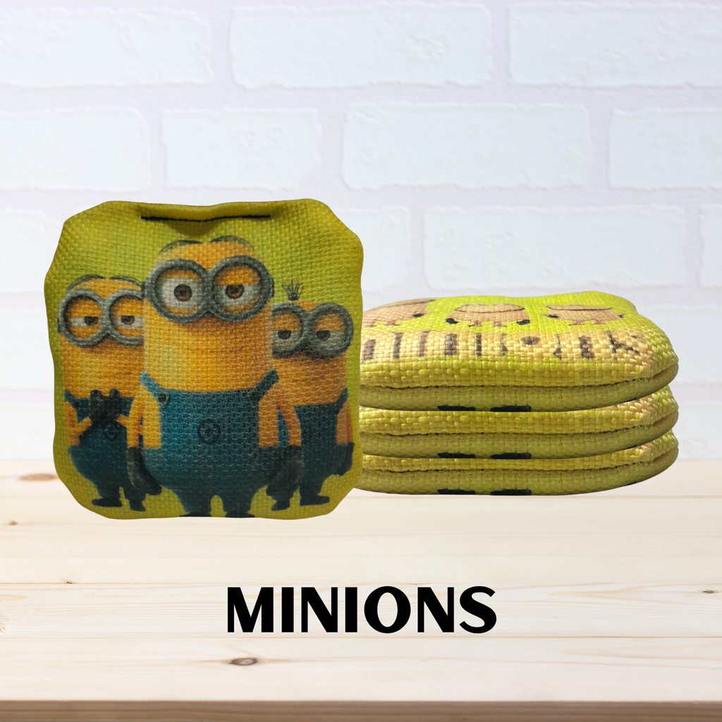 Mini cornhole bags of Minions theme on a light-colored background. 