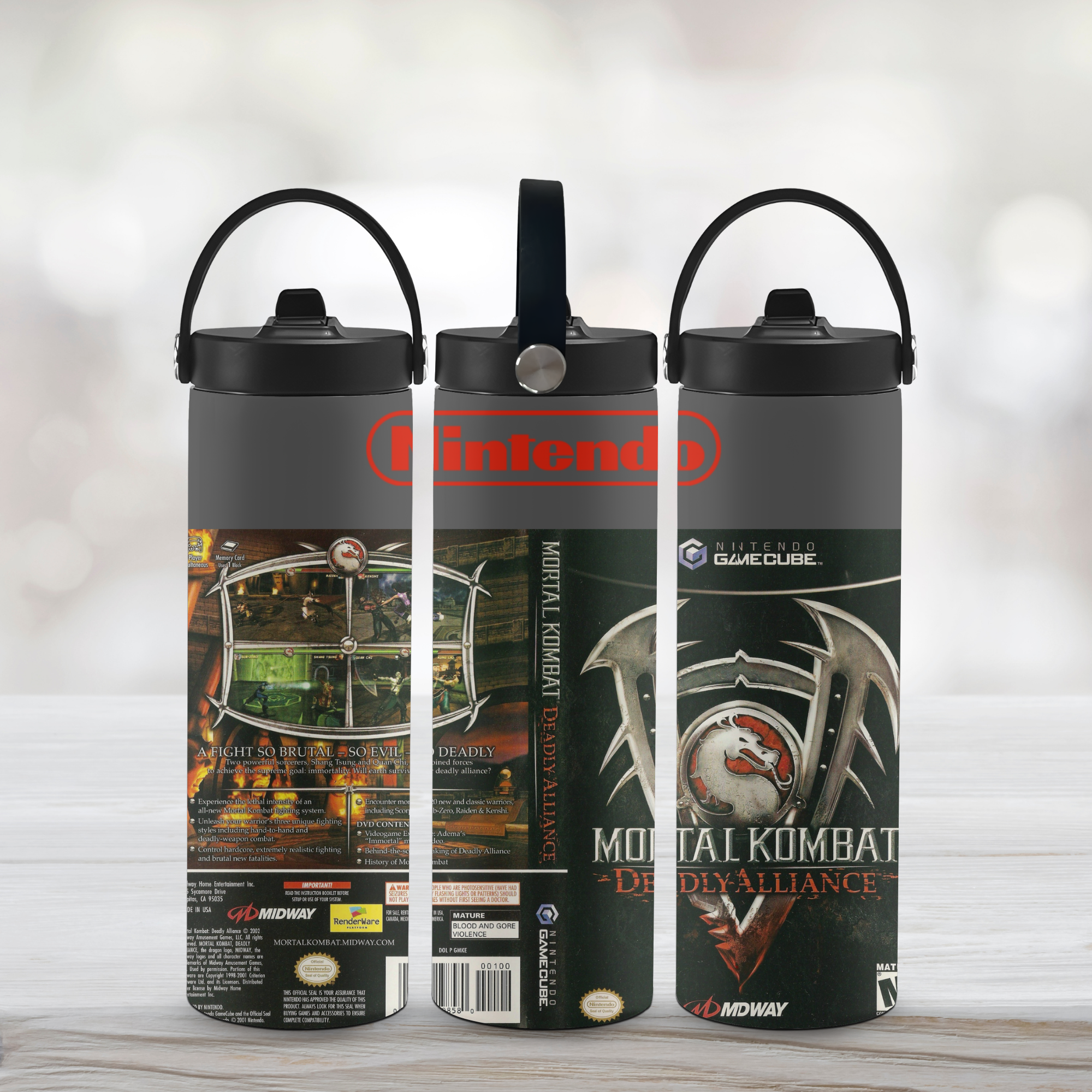 Three sports water bottles with Mortal Kombat design on a light-colored background. 