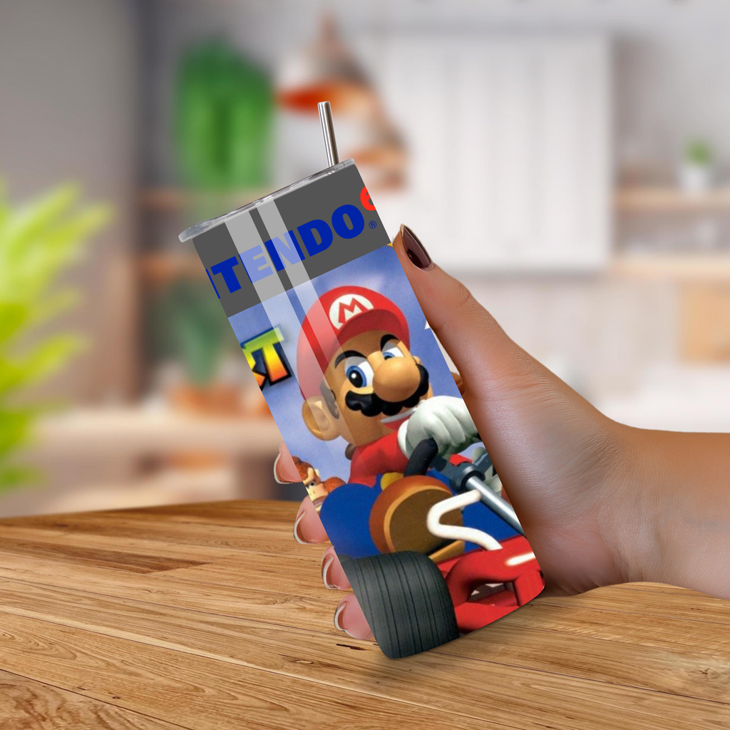 20oz tumbler with Mario kart 64 design held by a hand on a wooden surface