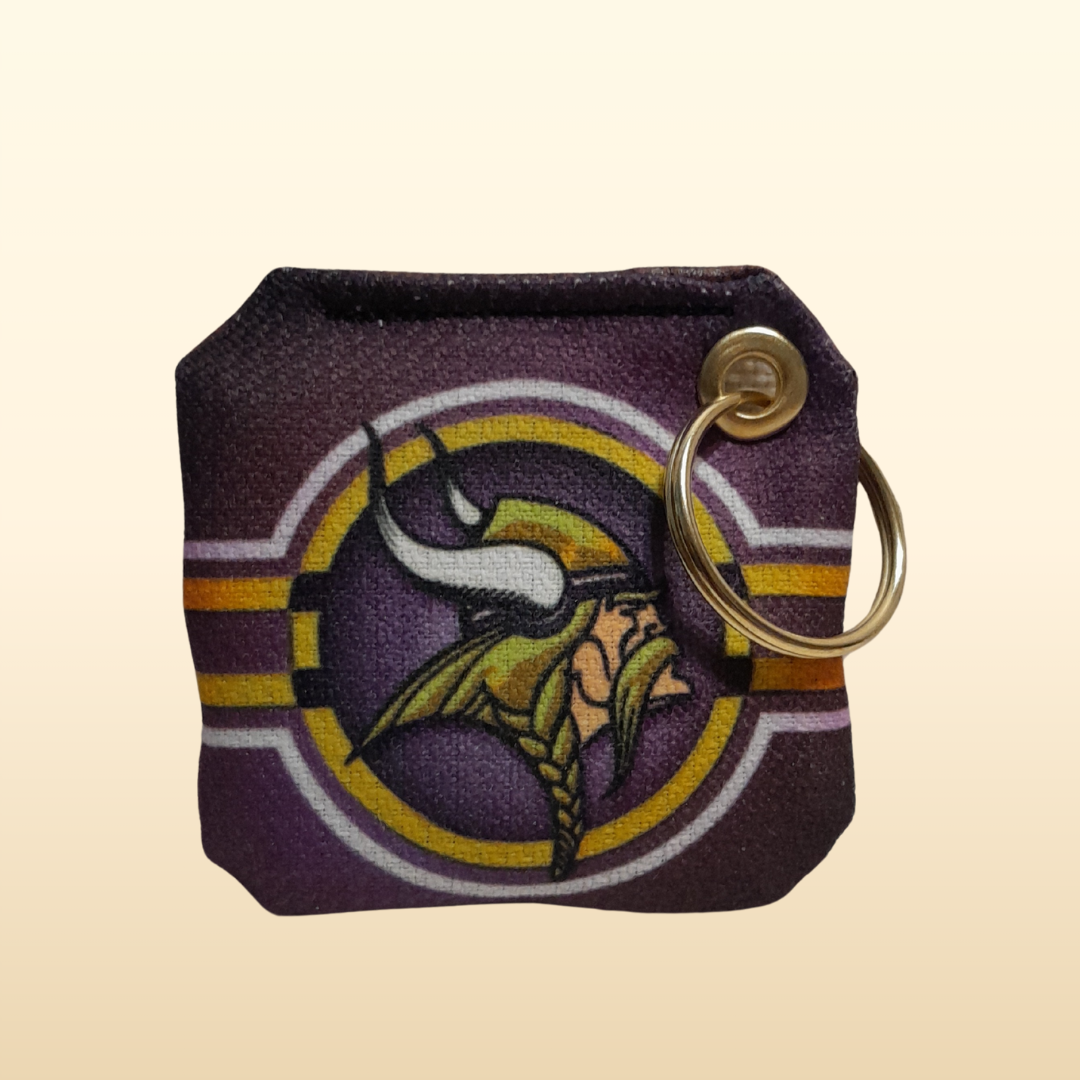 Keychain with a Minnesota Vikings logo on a beige background