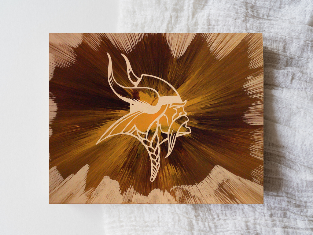 Custom Minnesota Vikings wall art created using spin‑art technique with bold team‑color patterns