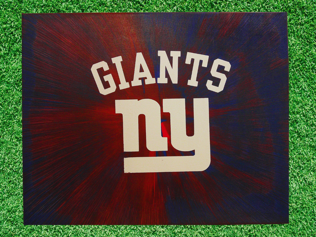 New York Giants logo on a dark background with grass texture