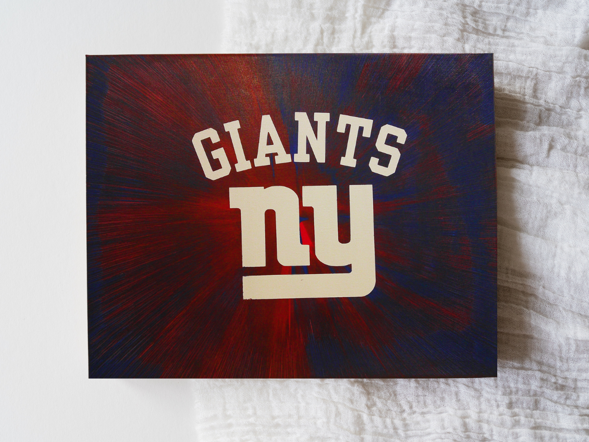New York Giants logo on a dark blue and red background
