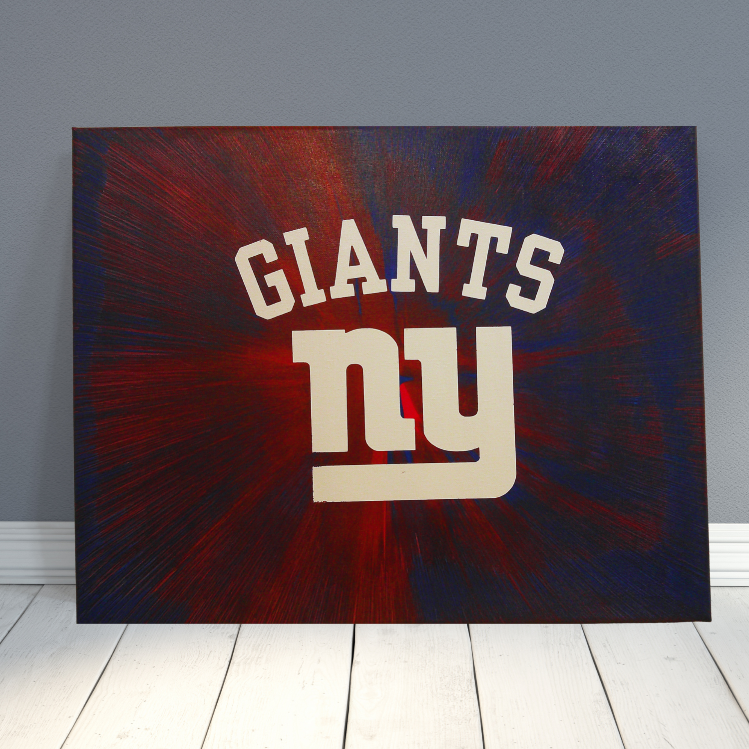 New York Giants logo on a dark background with red and blue hues