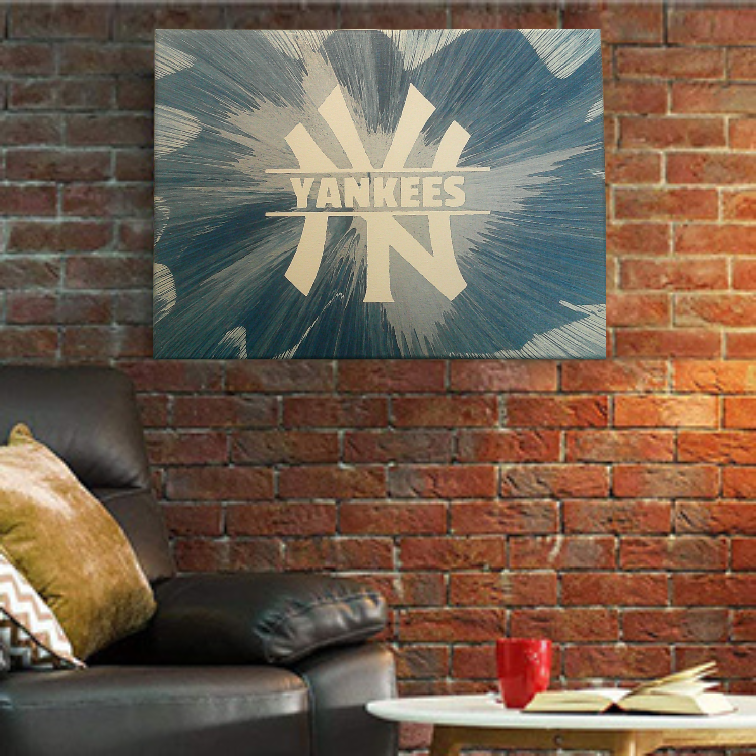 New York Yankees Spin Art painting on a brick wall with a couch and coffee table in the foreground.